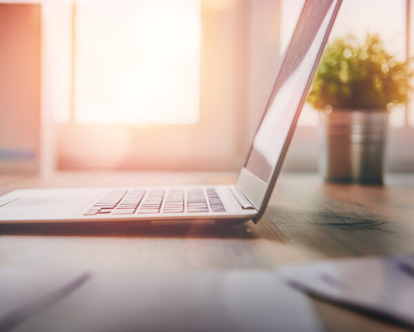 Laptop on a desk for online therapy in Ohio